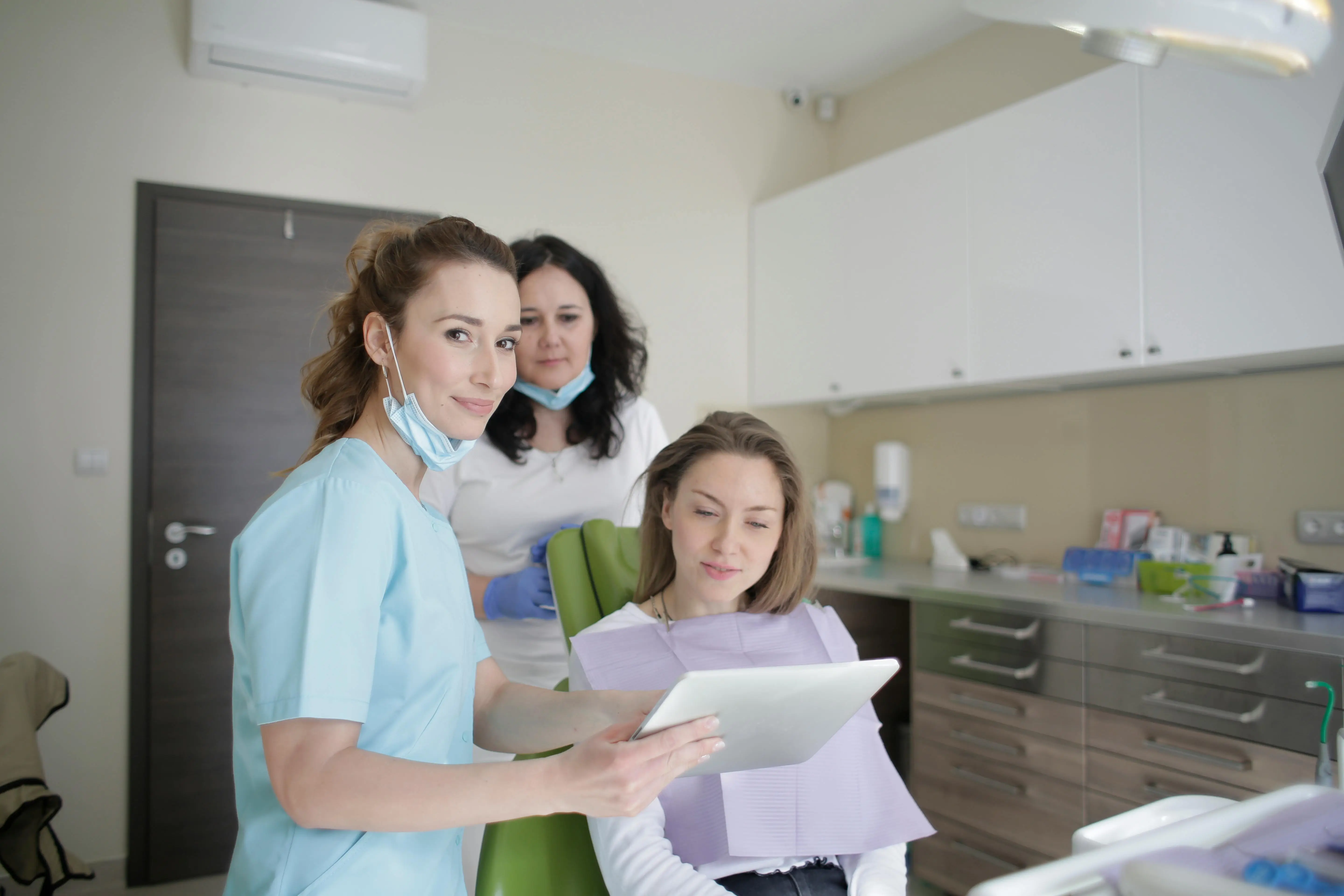 Dentist explaining treatment options to a patient