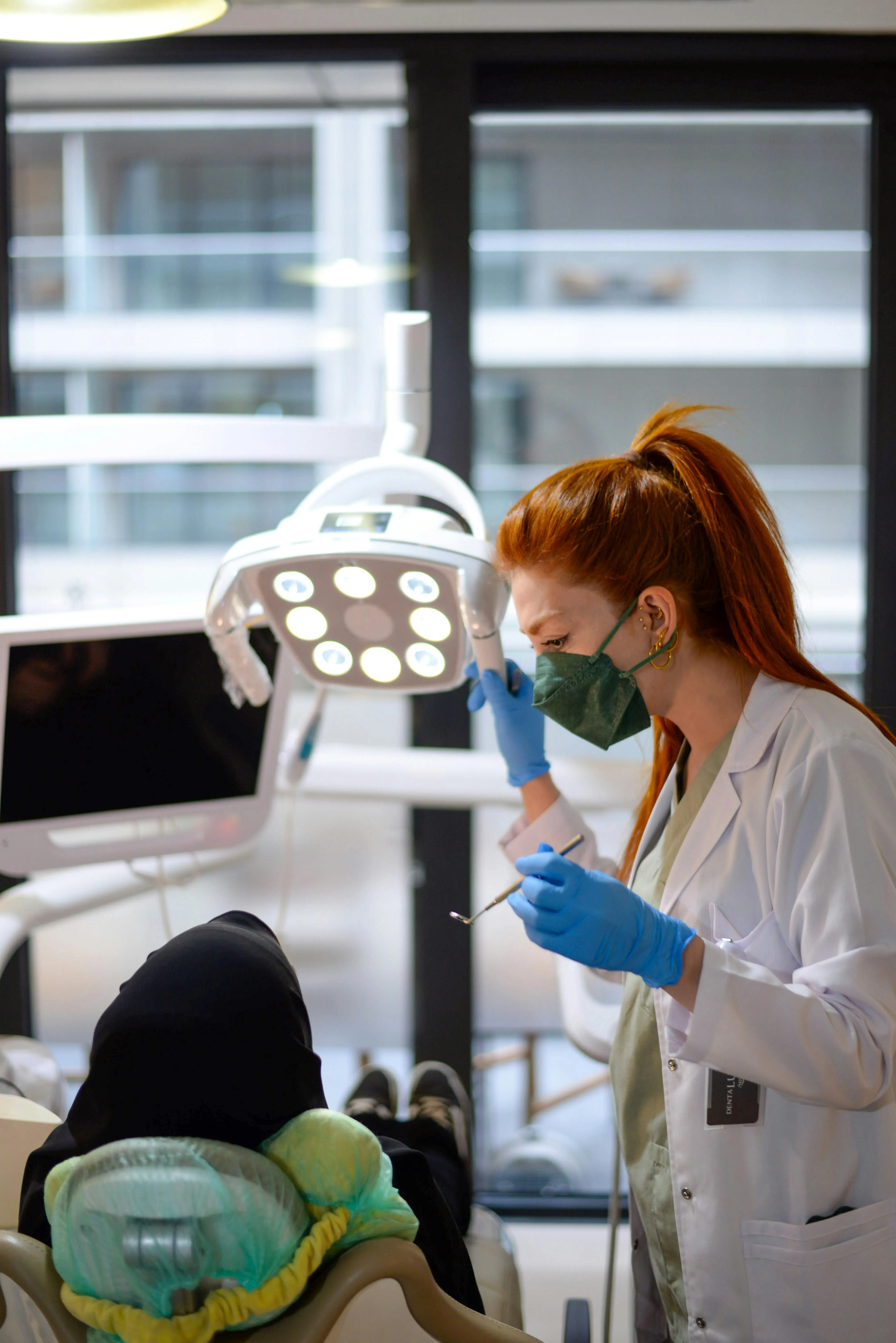 Dentist preparing treatment in a modern dental clinic