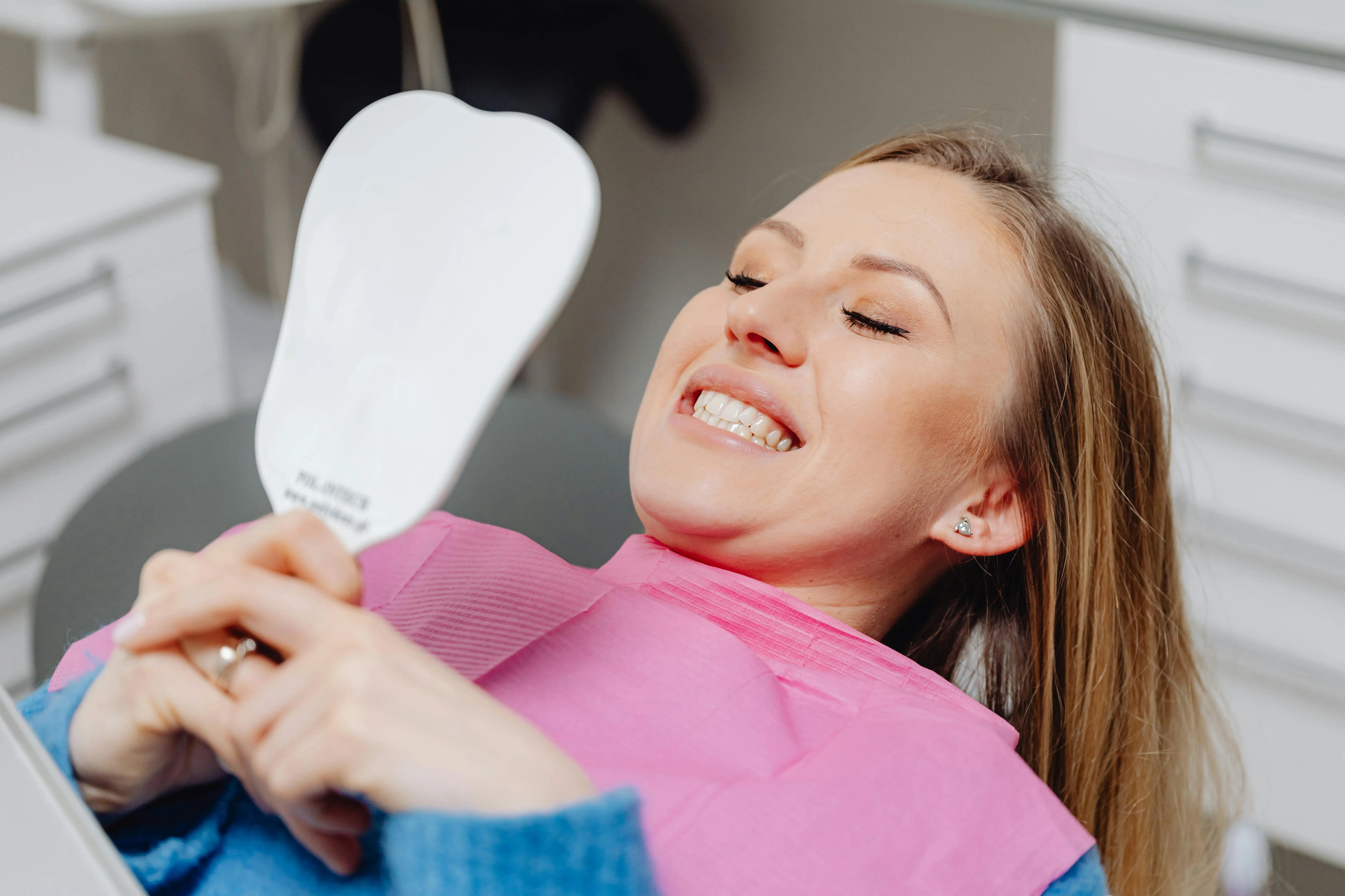 Happy dental patient smiling after treatment